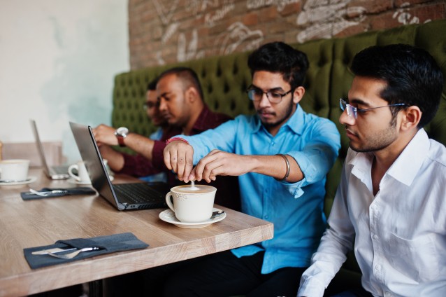 Corporate team collaborating in a modern coworking space in India