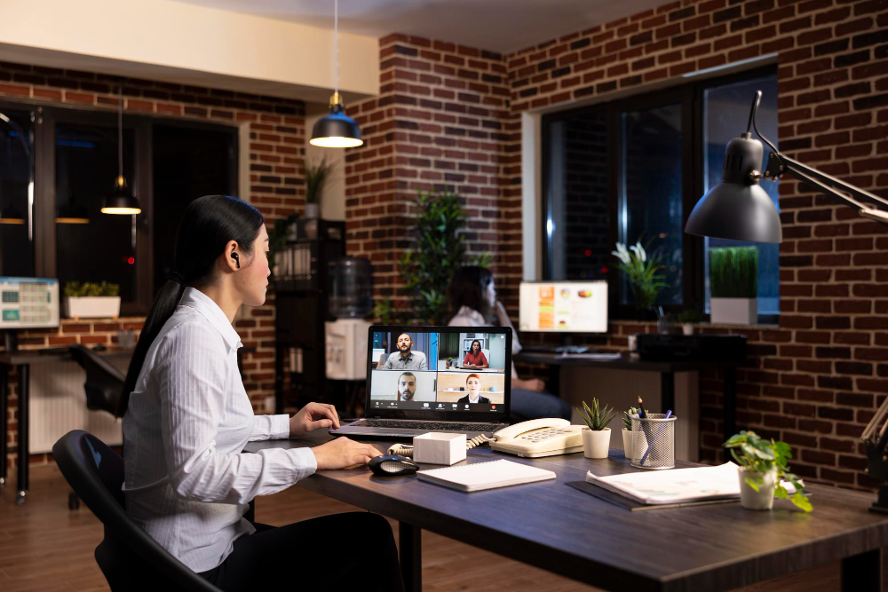 Professionals collaborating in a modern coworking space 
