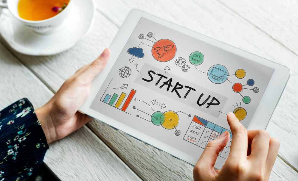 Entrepreneur planning startup growth on digital tablet Entrepreneur planning startup growth on digital tablet