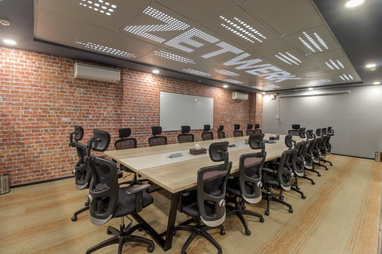 Well-designed conference room in a fully managed office setup with ergonomic seating